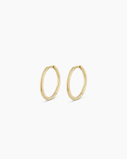 Woman wearing Classic Gold Huggie || option::14K Solid Gold, 15mm