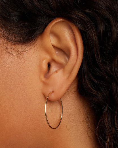 Woman wearing Classic Gold Hoop || option::14K Solid Gold, 30mm