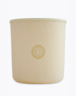 Beige candle with a logo on a white background